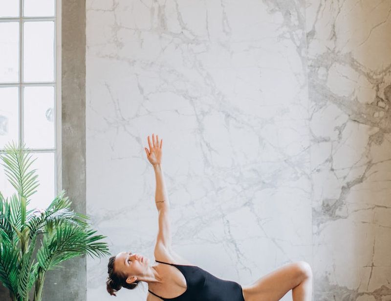 A person in a difficult balancing yoga pose.